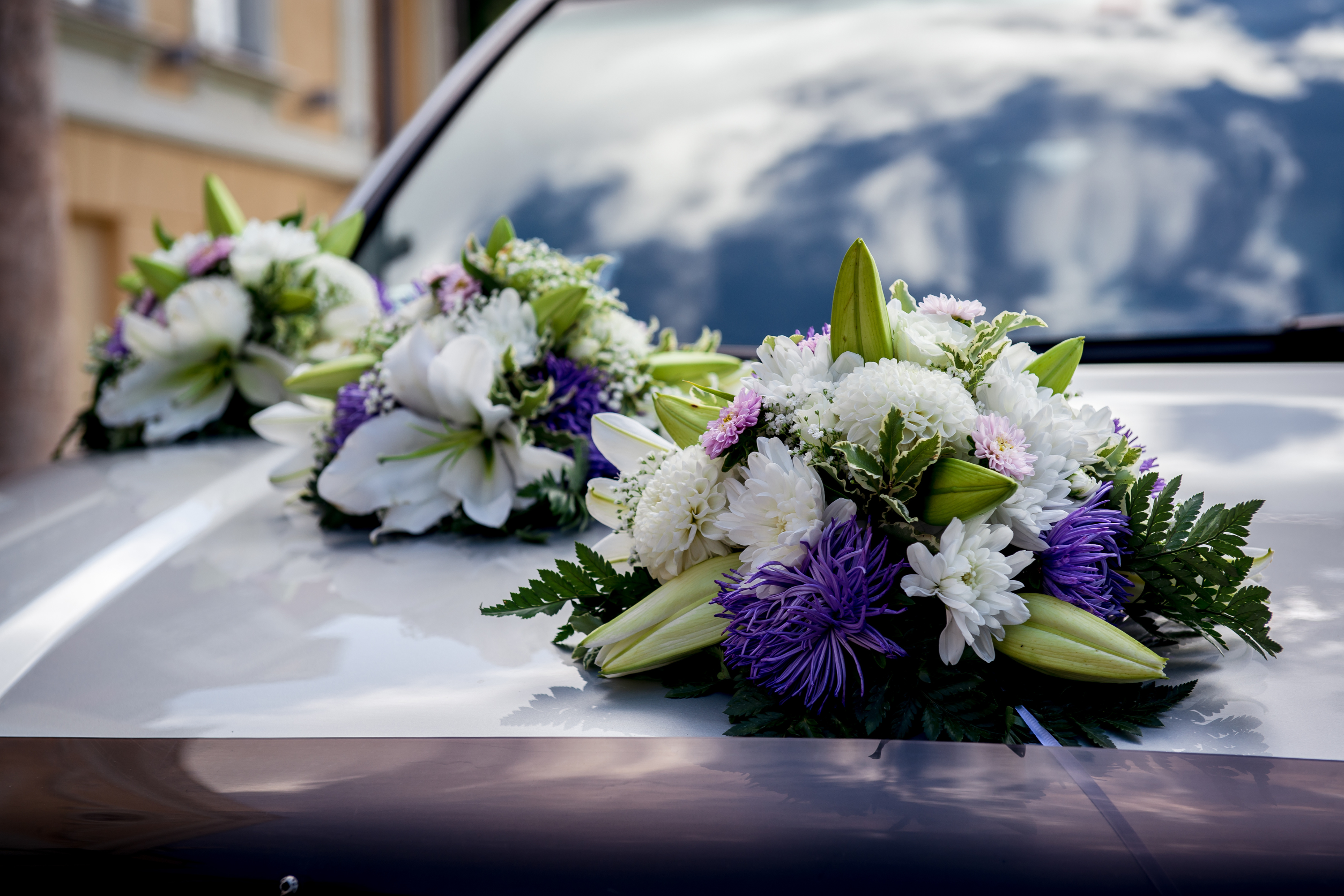 Flowers on the hood of a car.
