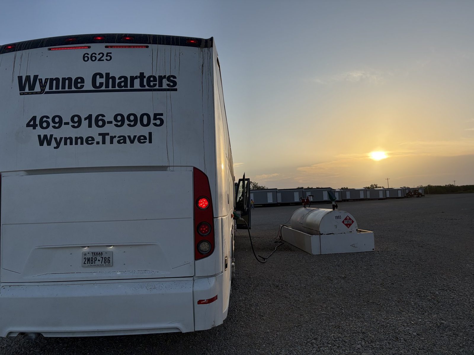 Rear of a Wynne Charters motorcoach with phone number and website